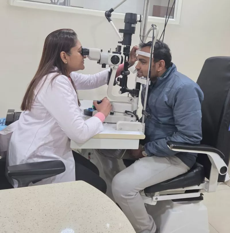 Dr. Deepa Gupta examining a patient on a slit lamp at Satvik Eye Care, Gurgaon